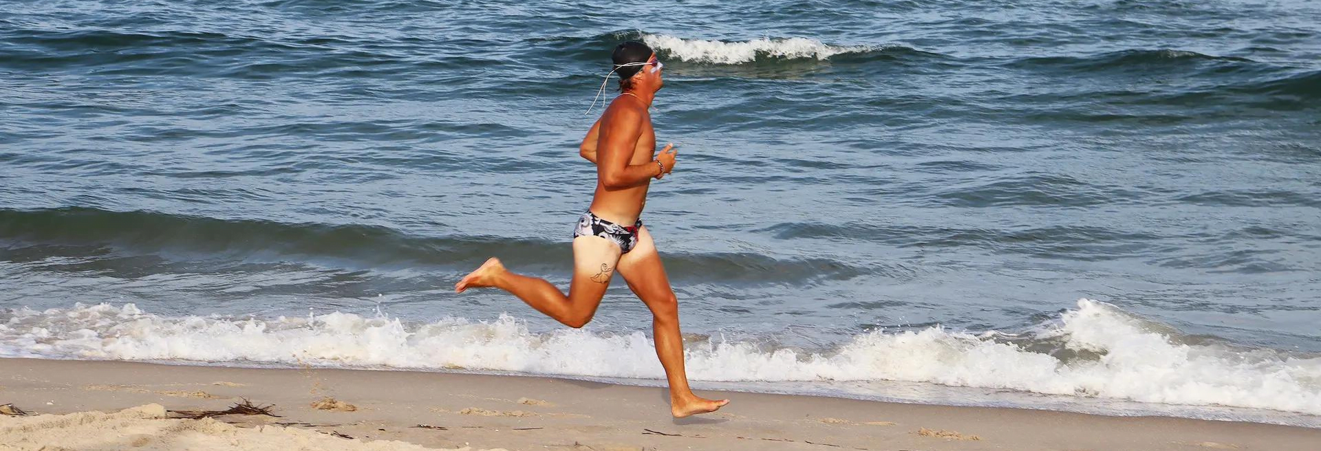 Image of Shane S. running during the Surf City Epic.